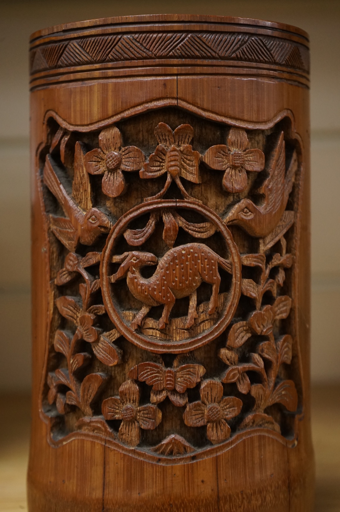 A Chinese carved bamboo vase, 19cm high